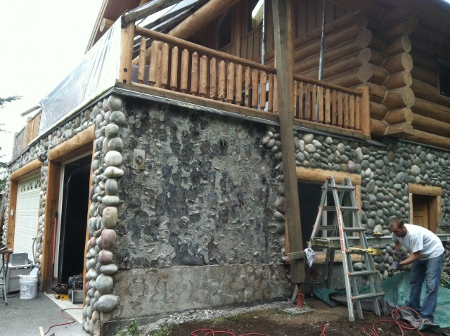 removing stone work to expose damaged wall