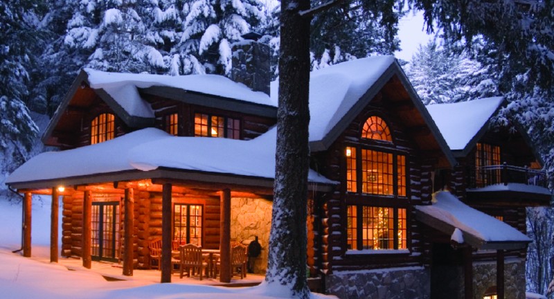 snowy log house